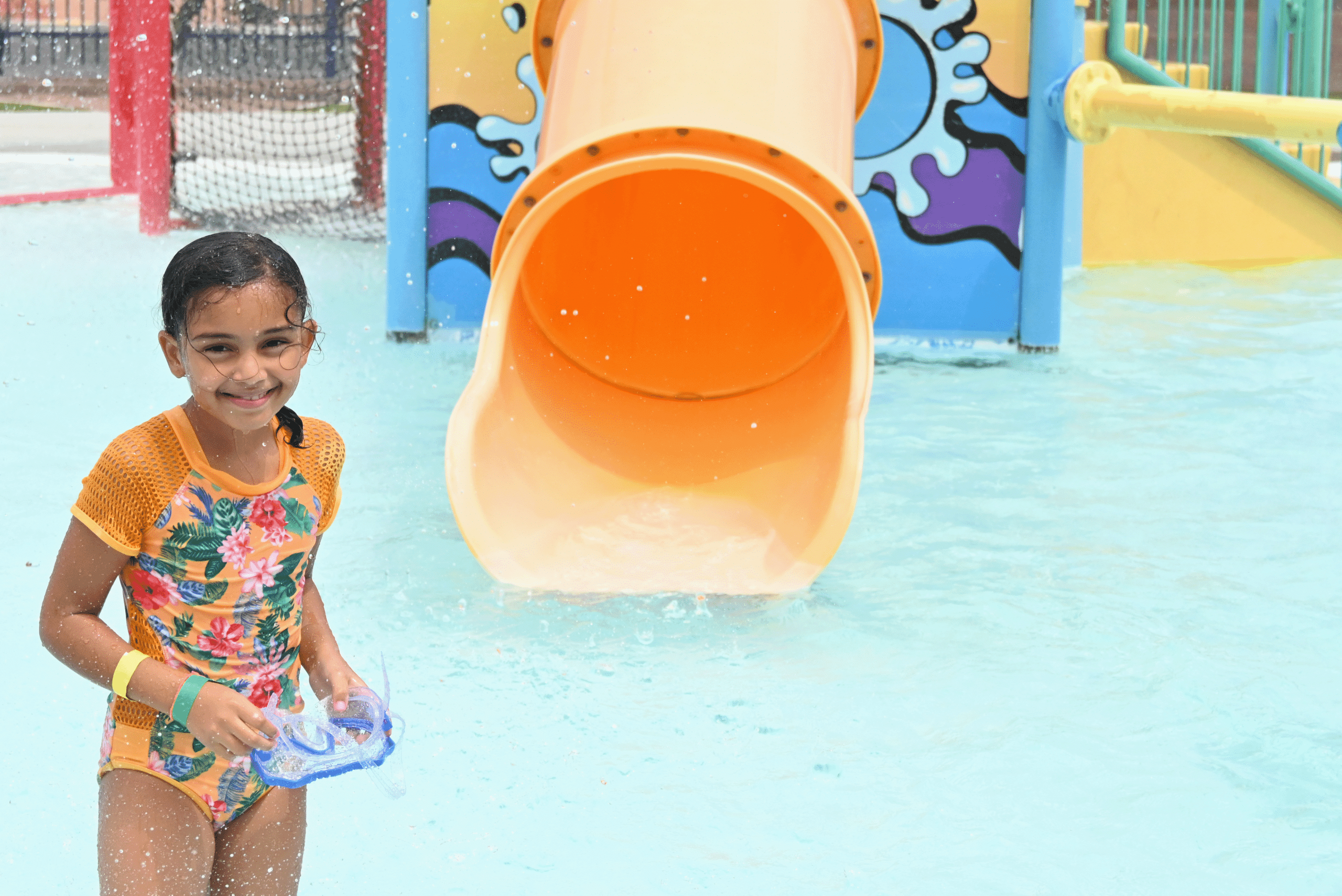 girl in front of slide at YMCA of Southern Nevada
